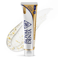 Tube of Royal Denta toothpaste with gel swatch with gold particles on a white background